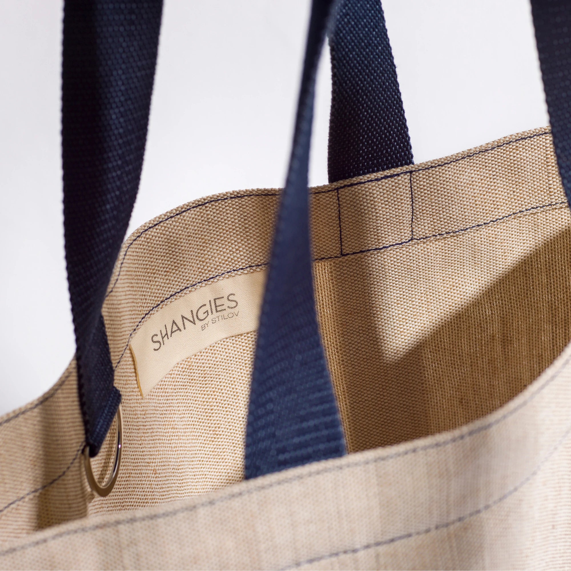 Beige tote bag with Midnight Blue straps and 'SHANGIES' logo on a white background | Lifestory