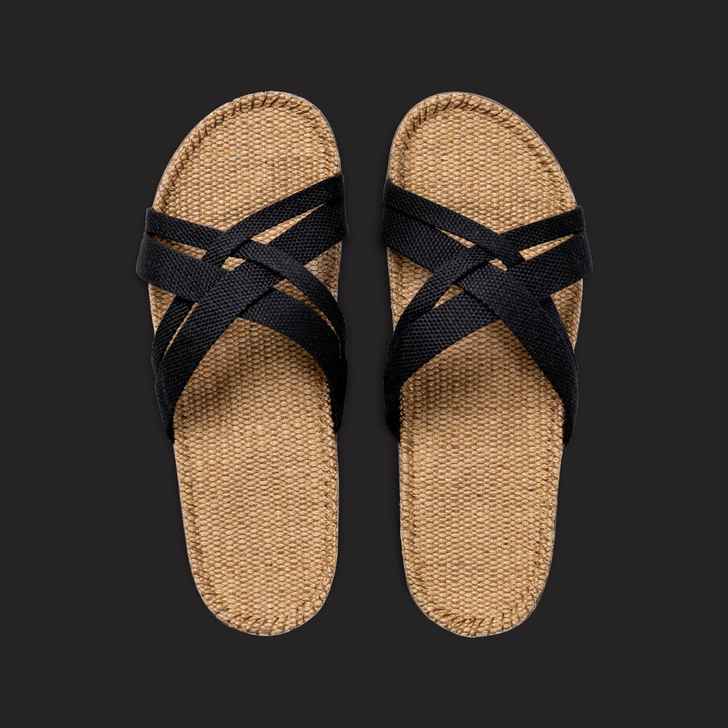 A top view of a pair of womens Shangies sandals with black straps and a natural jute sole