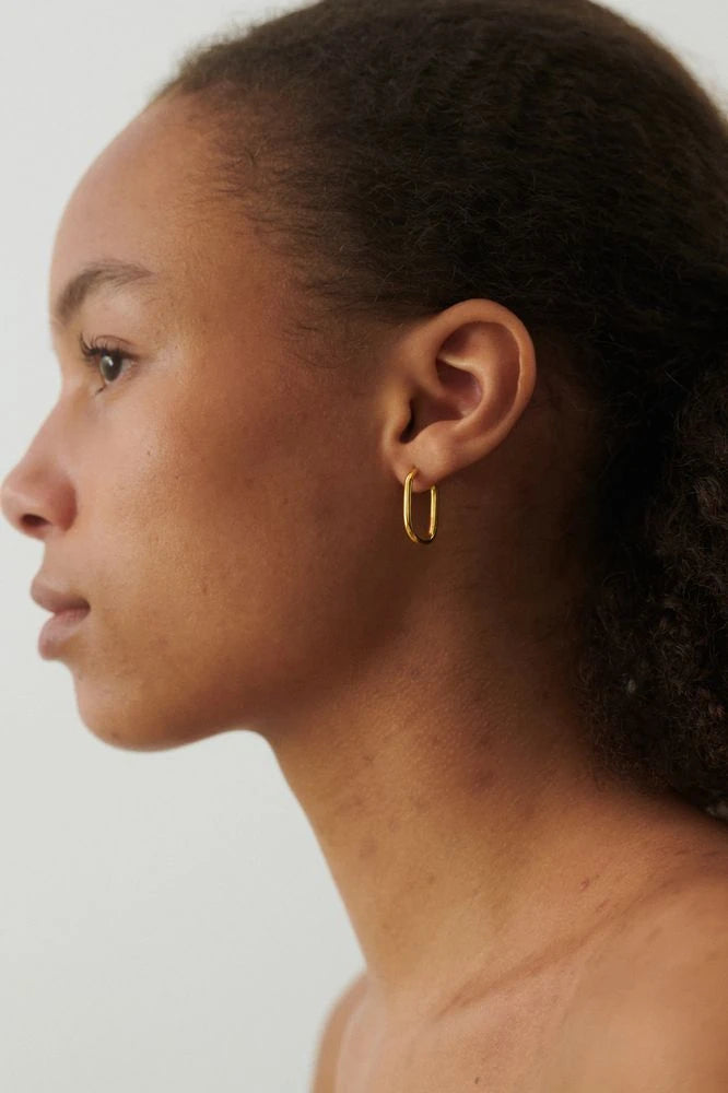 Soft Edge Huggies Earrings in Gold Plated Silver by Pernille Corydon | Lifestory