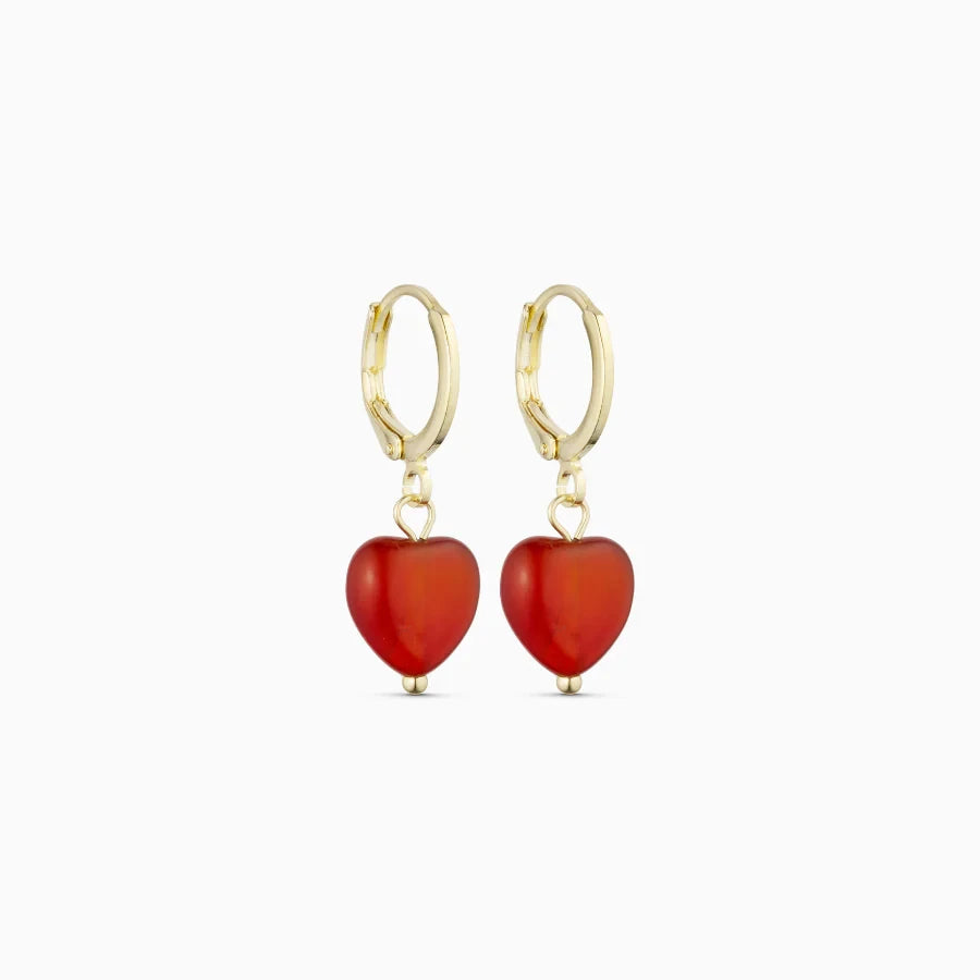 Soï Copenhagen Alma heart earrings in 18k gold with a Red Jade crystal heart