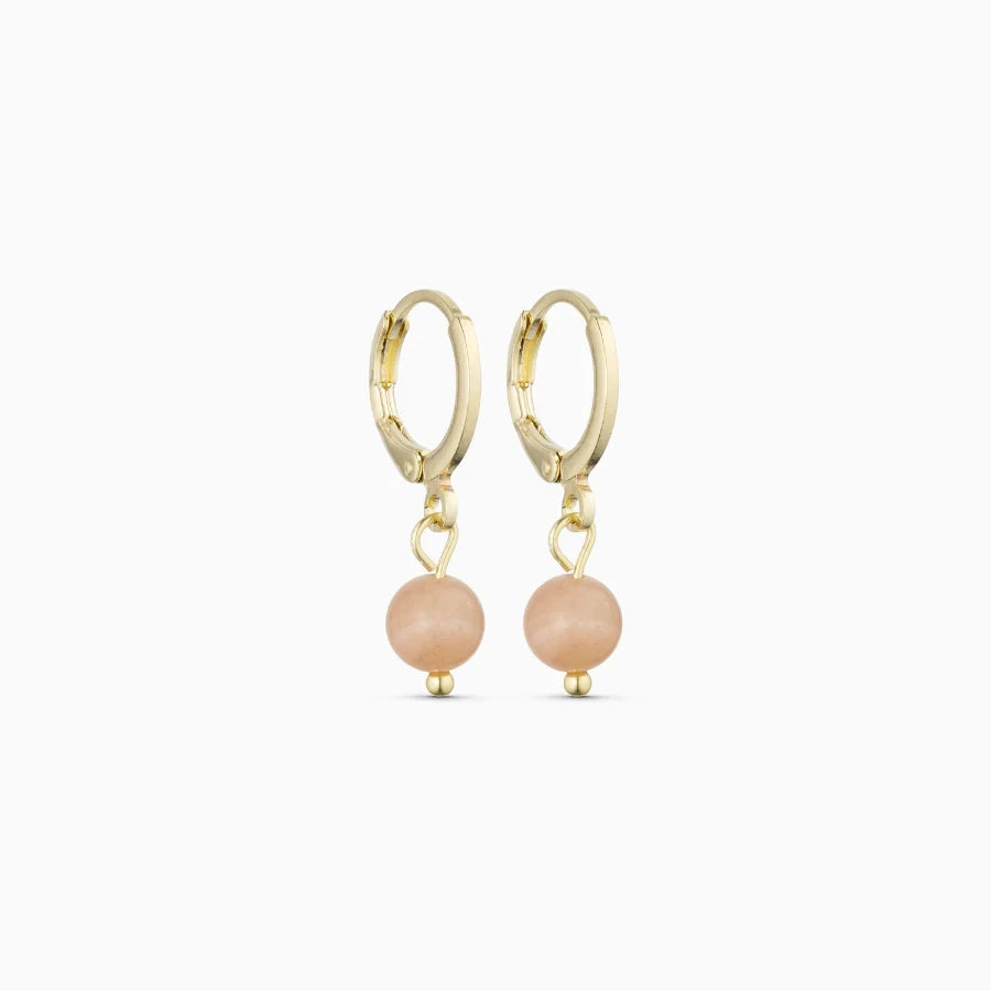 Soï Copenhagen Ava huggie hoop earrings in 18k gold with a Sunstone stone