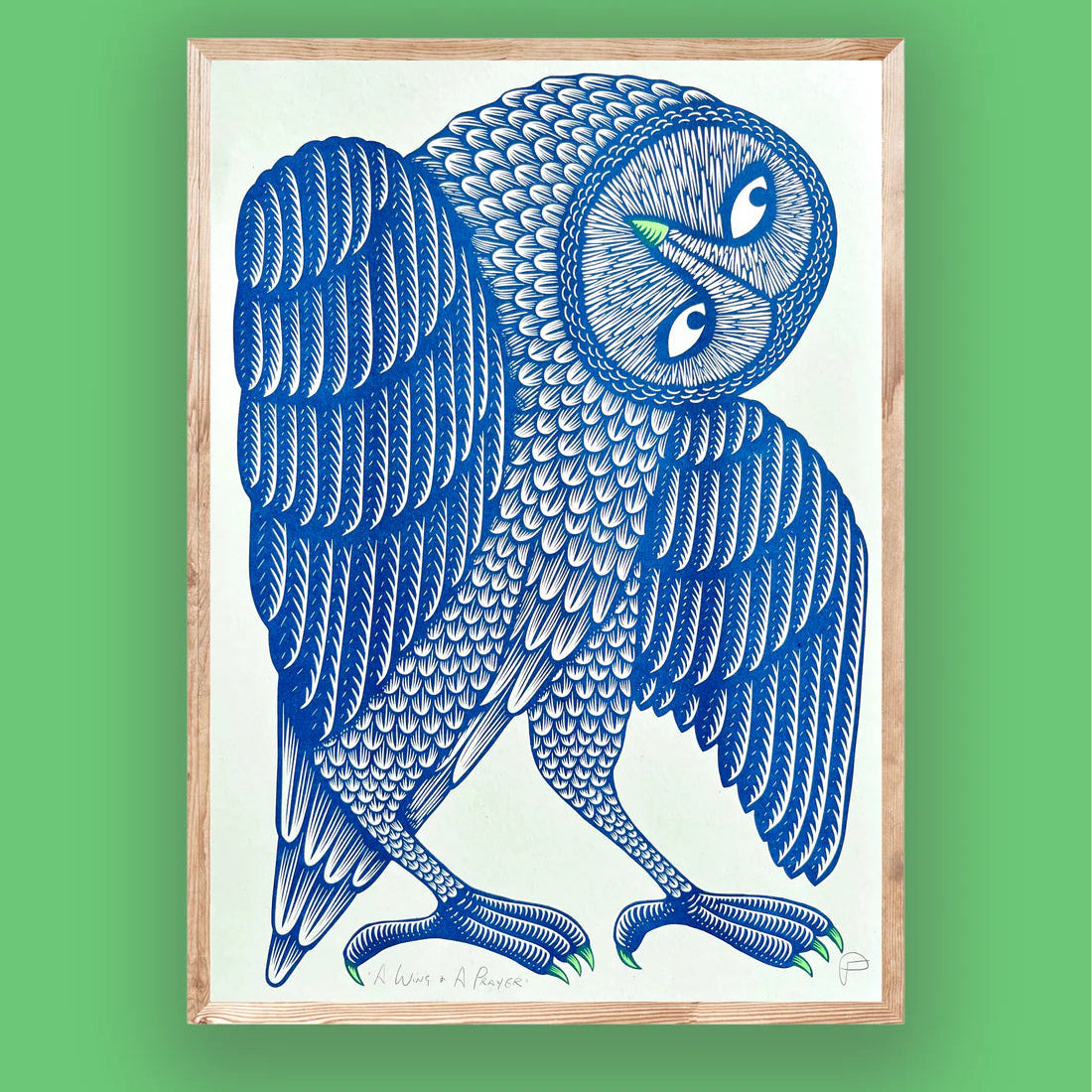 Framed artwork of a blue owl on a green background