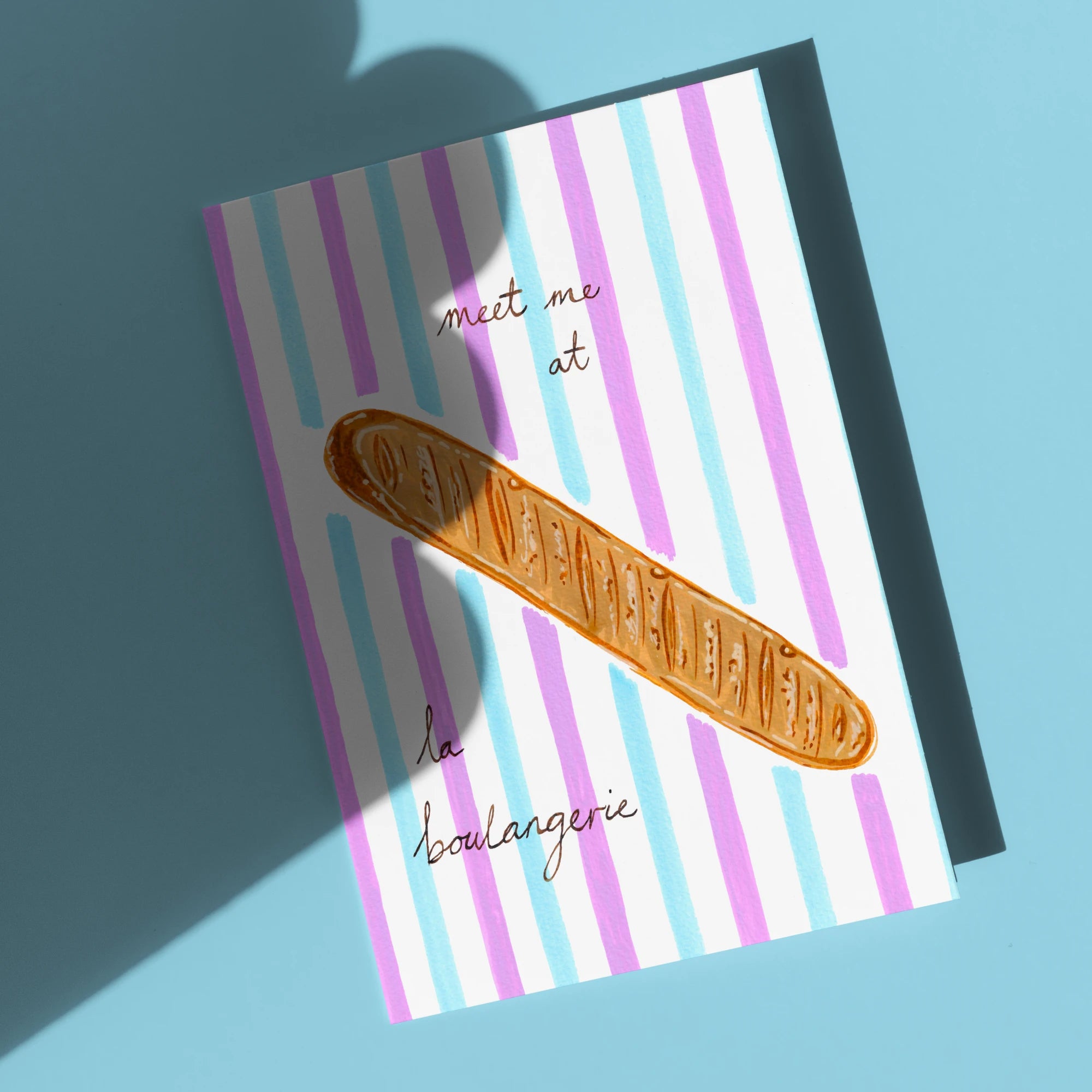 Meet Me At La Boulangerie Card by Tecari Designs on sky blue background