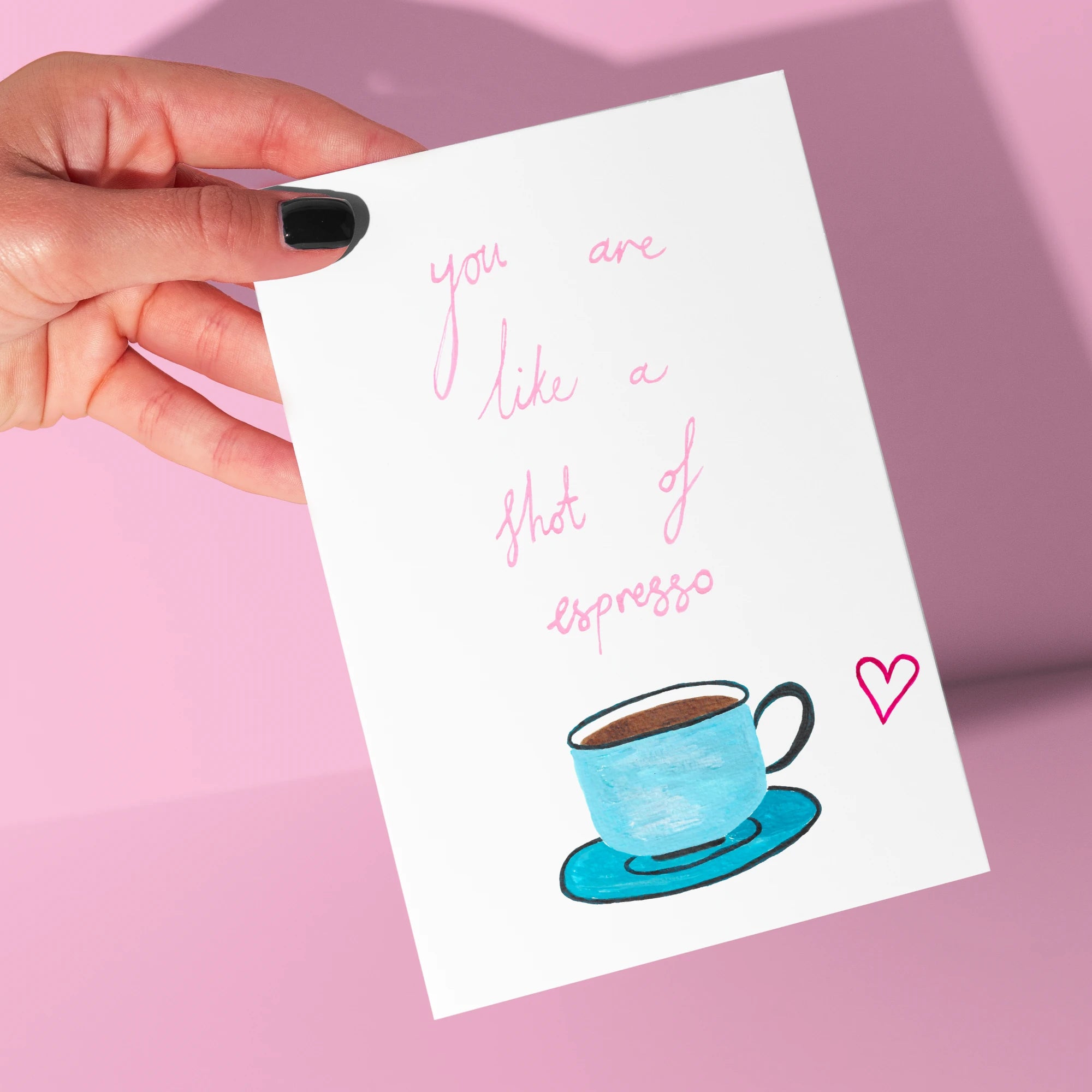 You Are Like A Shot of Espresso Card by Tecari Designs being held up against a pink background