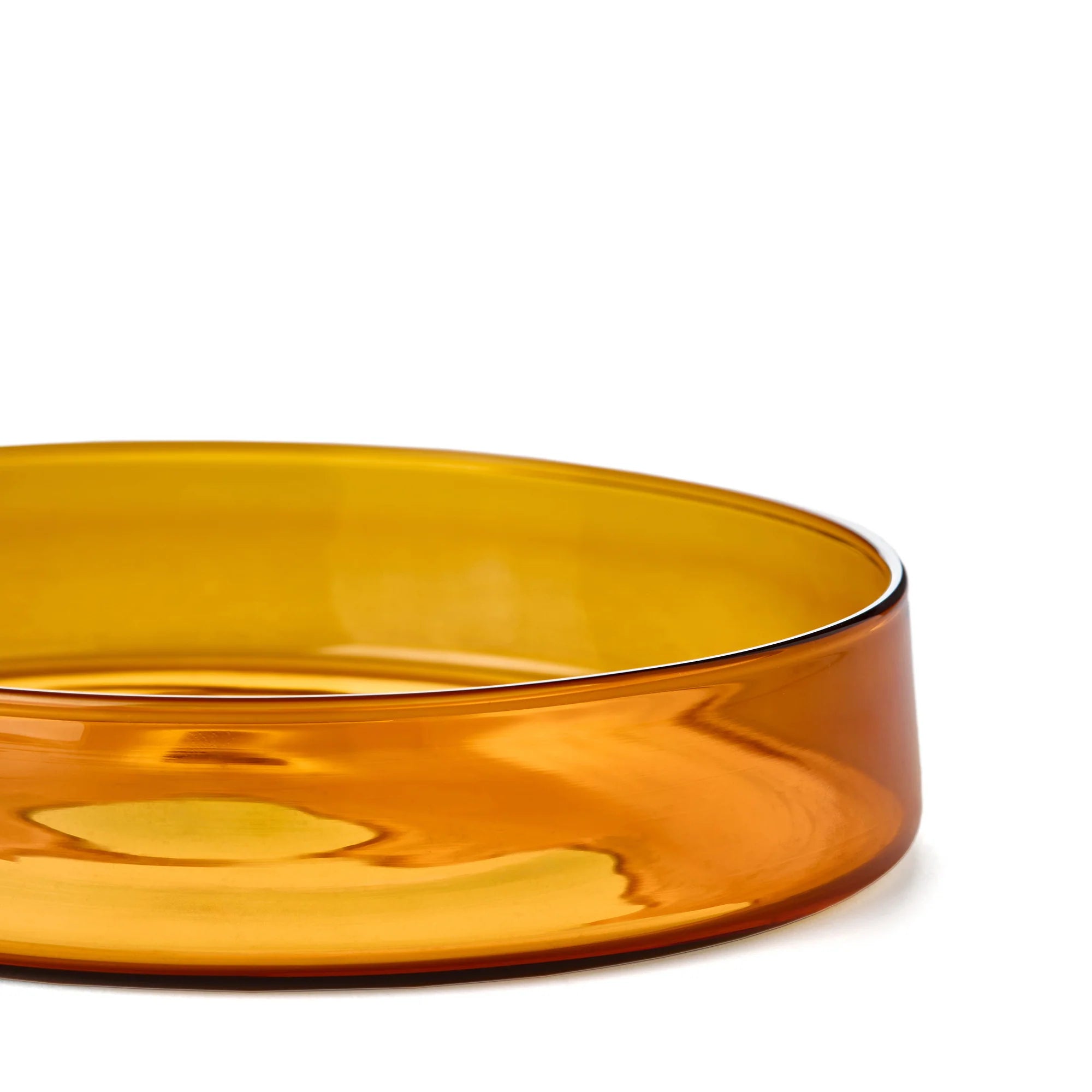 Amber glass bowl on a white background