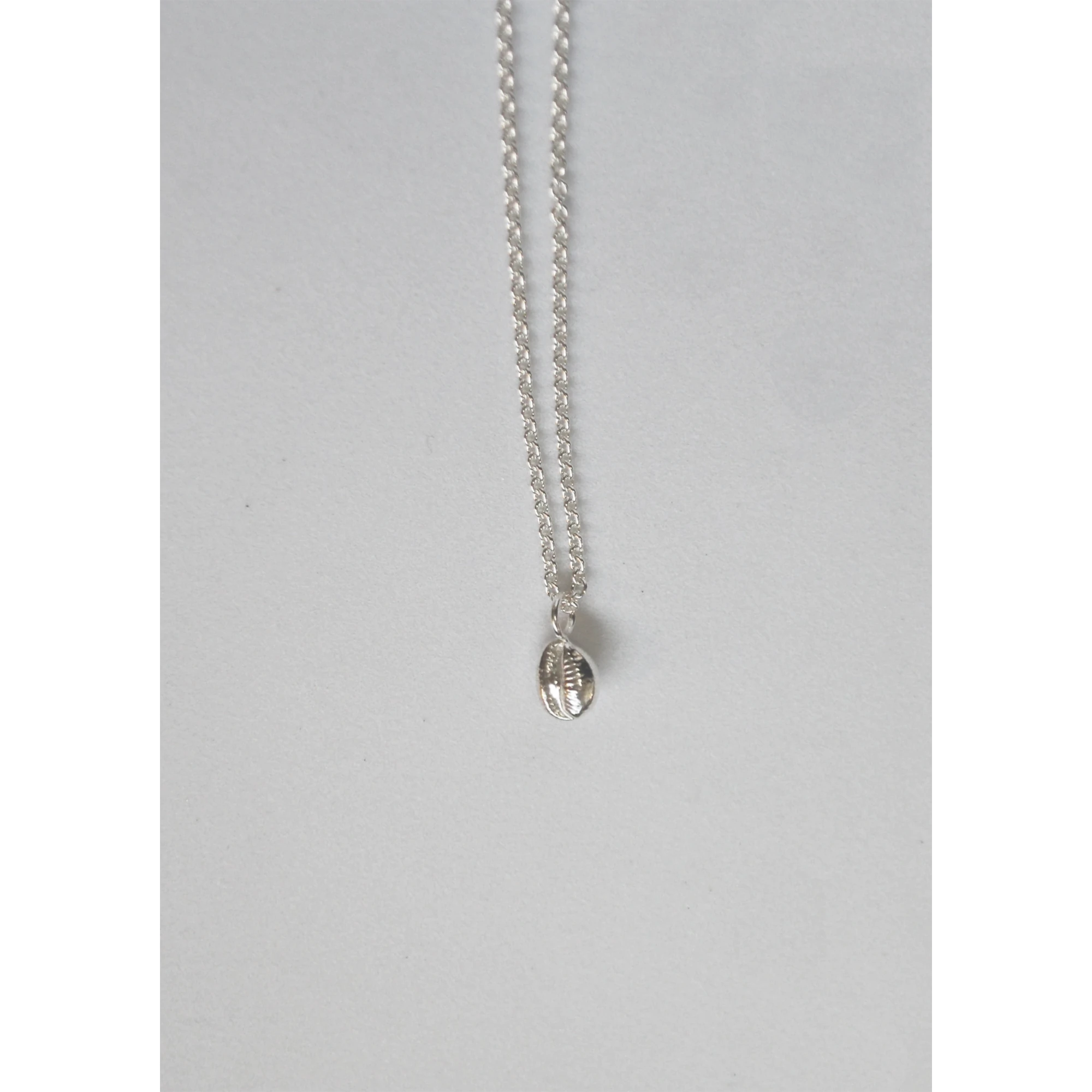 Tiny Cowri Shell Necklace in Silver by Hannah Bourn - Lifestory