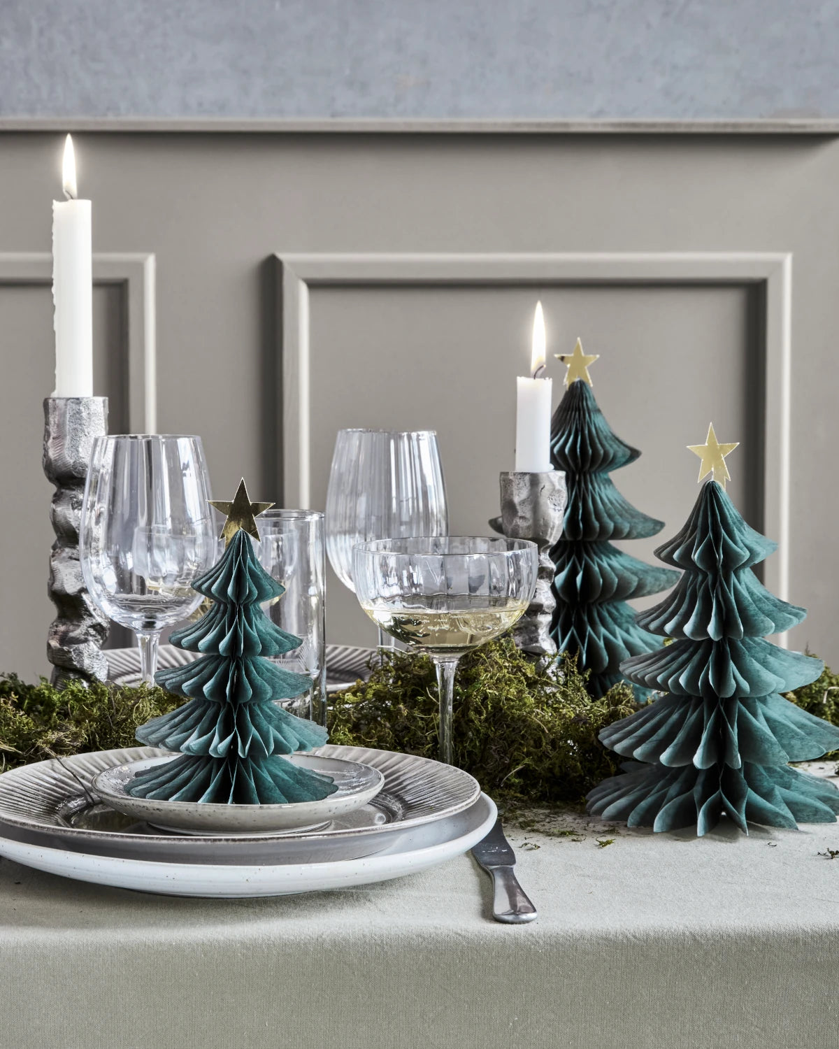 House Doctor set of 3 green paper fold out tree shaped decorations displayed on a festive dinner table