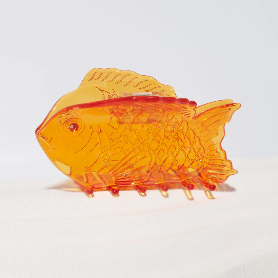 Winona Irene Sea Bream Ocean Fish Acetate Hair Claw in clear orange on a white background